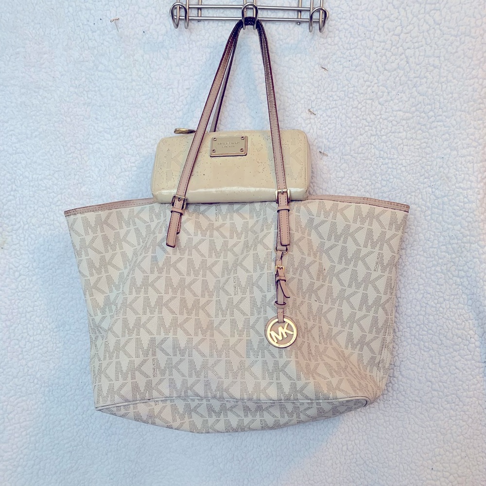 Woman’s Michael Kors purse and wallet